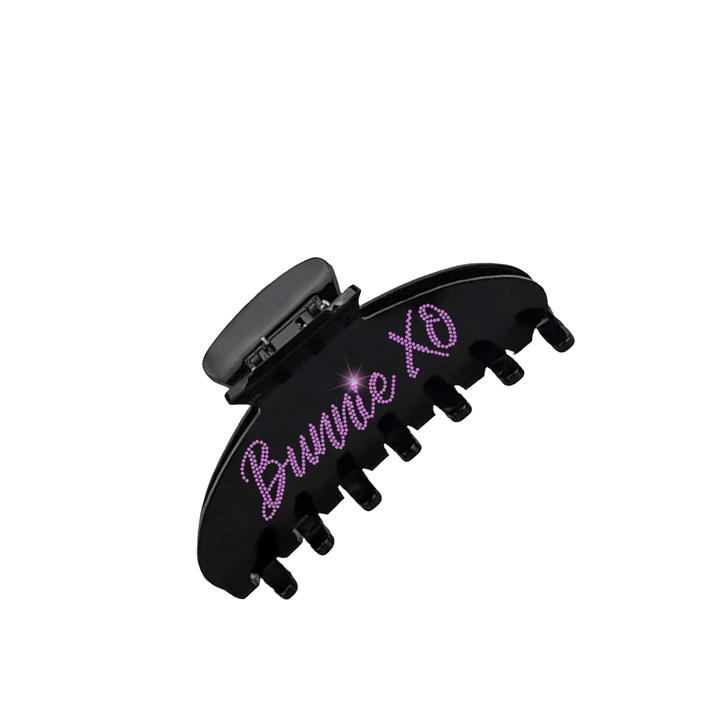 A black claw hair clip with Bunnie XO logo 