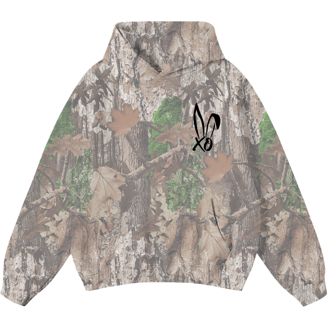 A classic pullover hoodie in a real camo print with Bunnie XO logo embroidered on the front in black. 