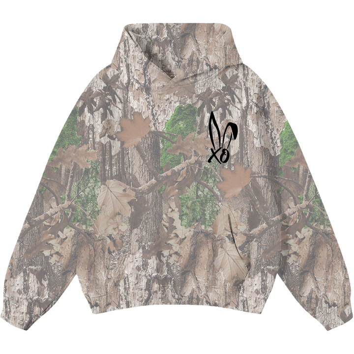 A classic pullover hoodie in a real camo print with Bunnie XO logo embroidered on the front in black. 