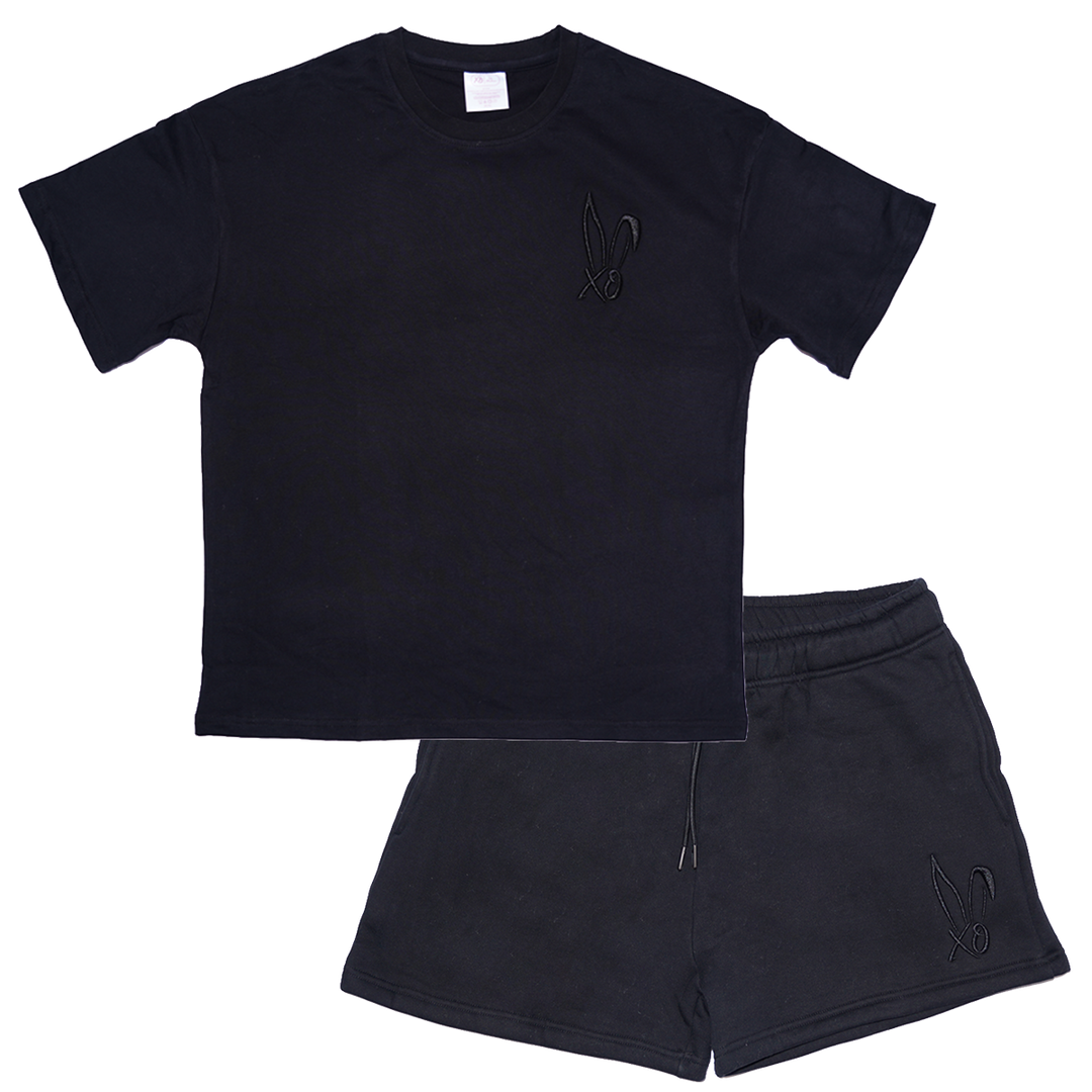 A black tee and sweat short set with Bunnie Xo's logo embroidered in black.