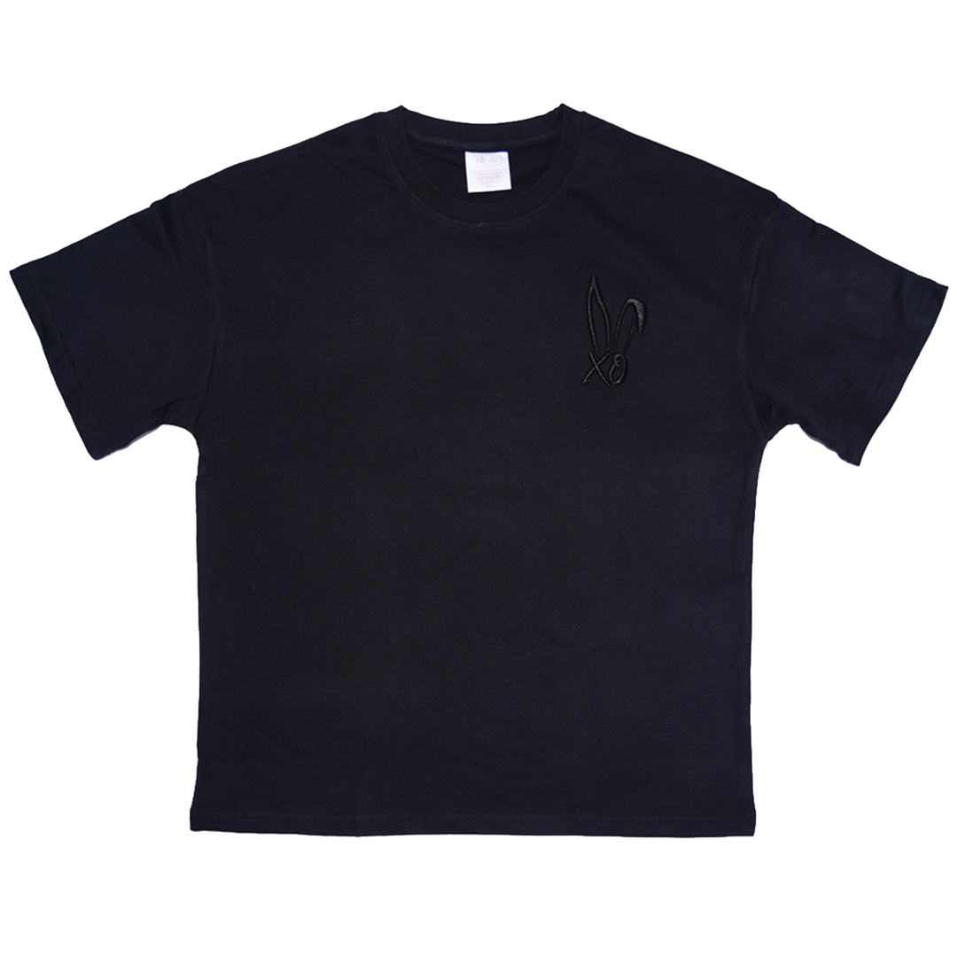 A classic black cotton tee with embroidered Bunnie Xo logo in black on the front. 