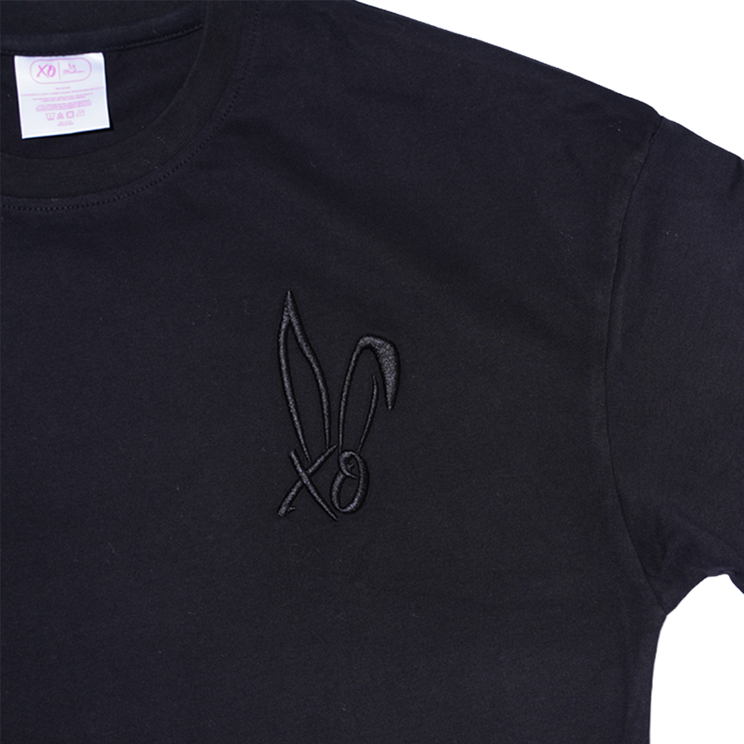 A classic black cotton tee with embroidered Bunnie Xo logo in black on the front. 