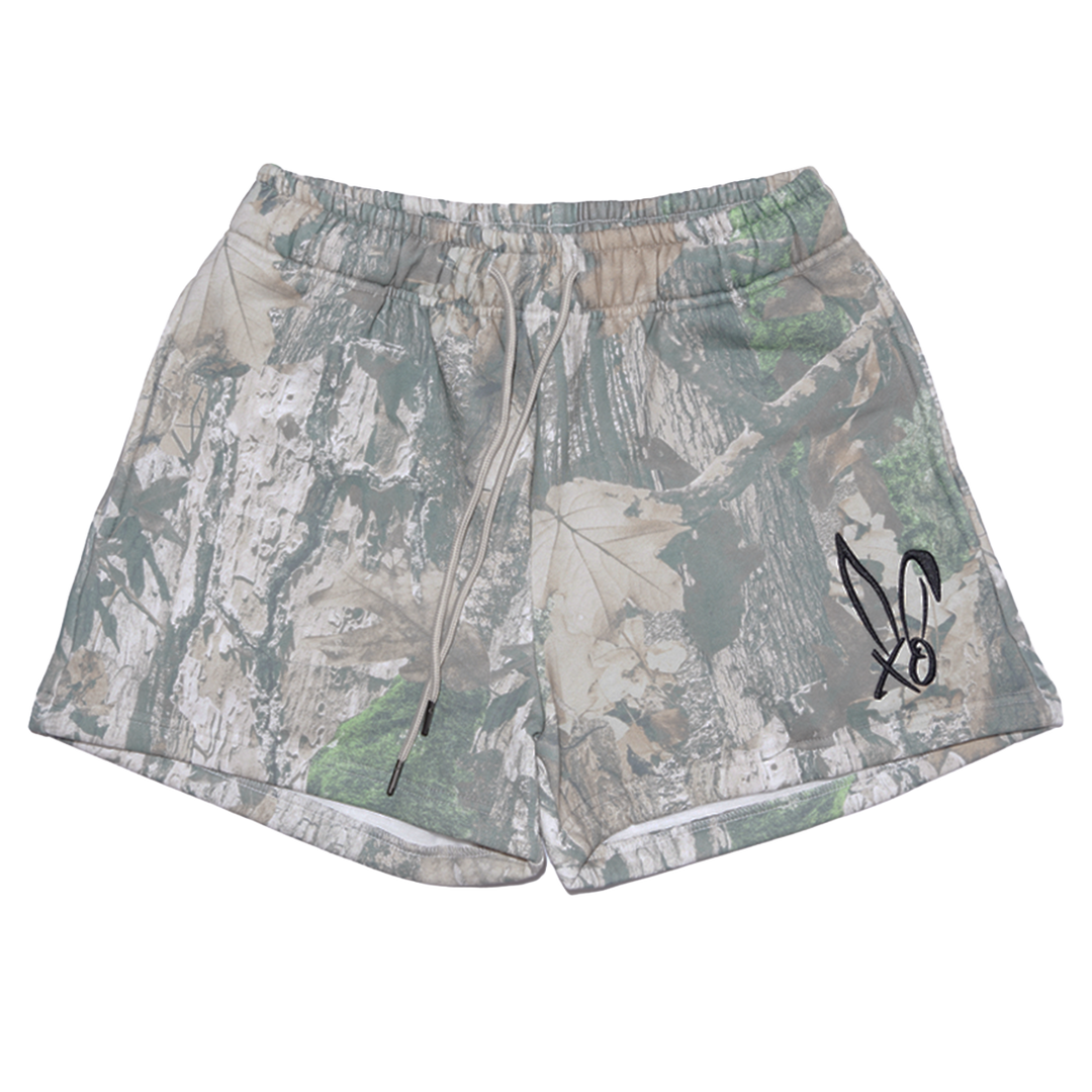 Classic real camo print fleece sweat shorts with the Bunnie Xo logo embroidered in black on the front. 